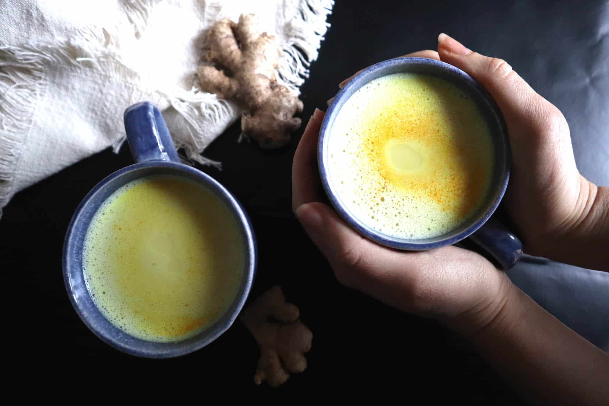 blue mugs with yellow milk